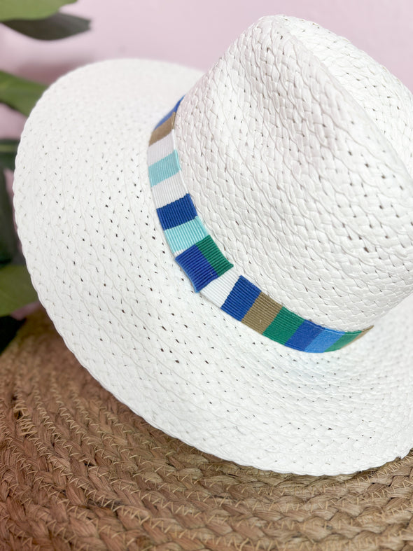 white hat with blue mutli band 