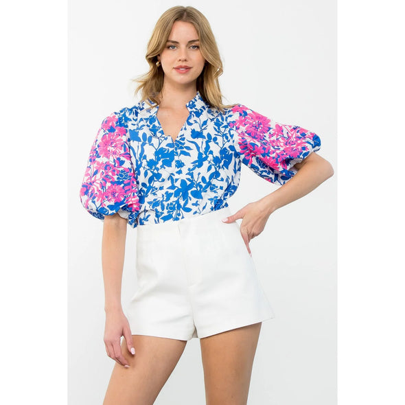 blue floral top with pink embroidered sleeves