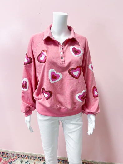 pink sweatshirt with sequin hearts