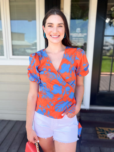 orange and blue tropical wrap top with bow 