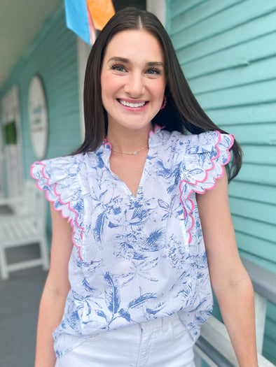blue floral top with pink outline 