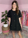 black dress with rhinestones and feathers