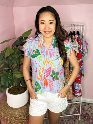 blue top with tropical print by THML 