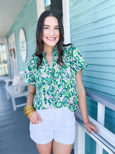 green print top with pink teal and white