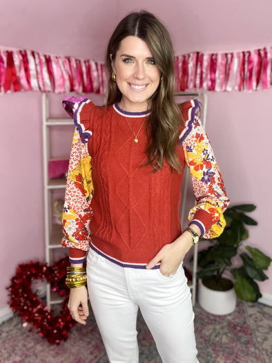 red knit sweater with statement floral sleeves