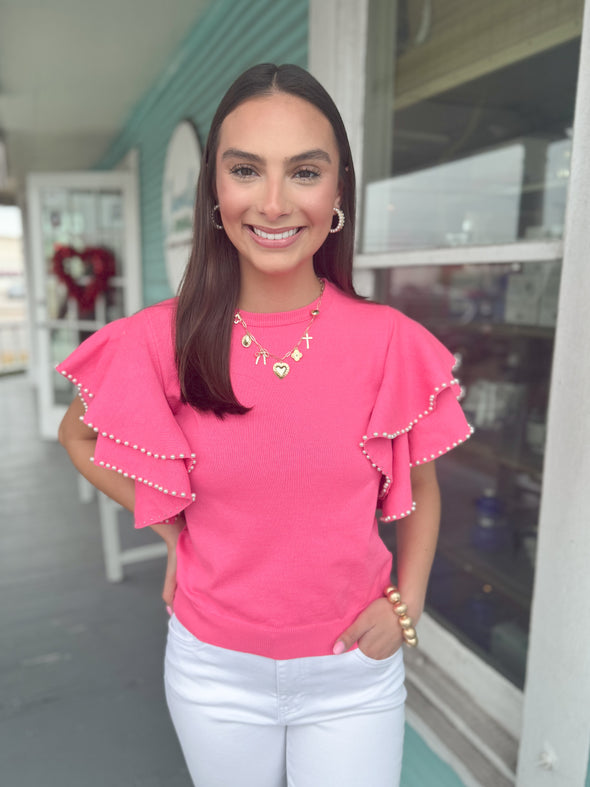 pink top with ruffle sleeves