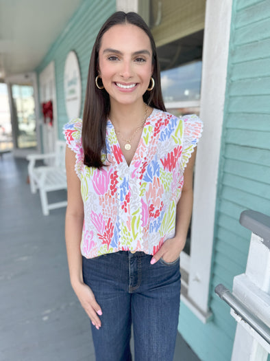 white colorul top with coral design 
