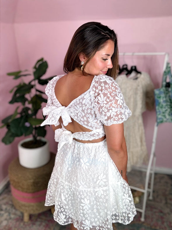 bow tie back of white floral embroidered dress