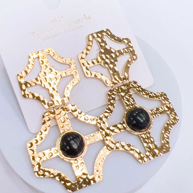 gold earring with black stone 